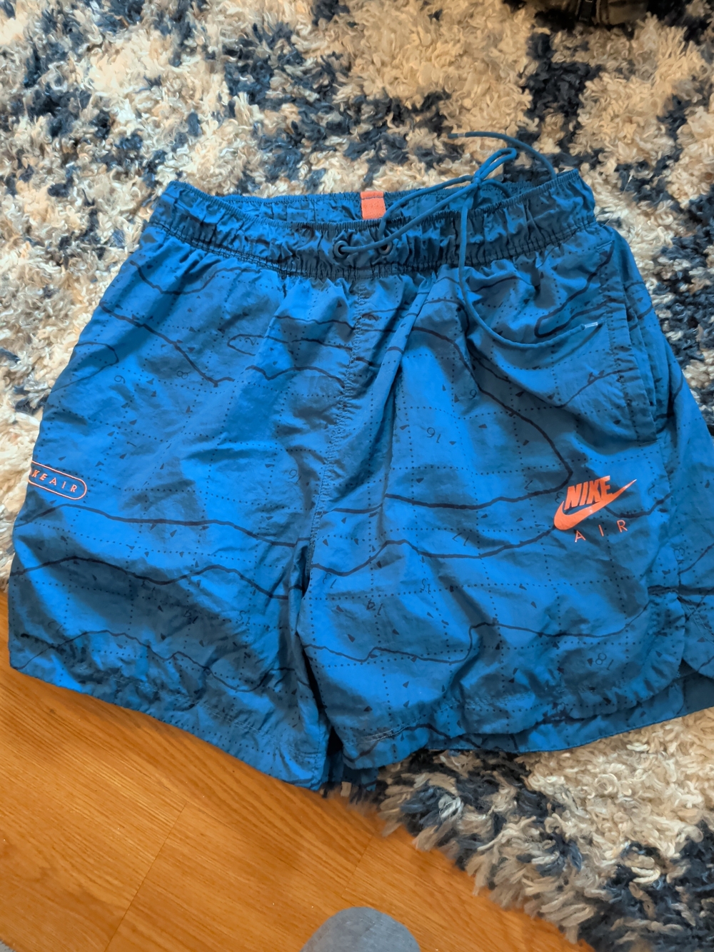Nike Blue Athletic Shorts with Orange Accent